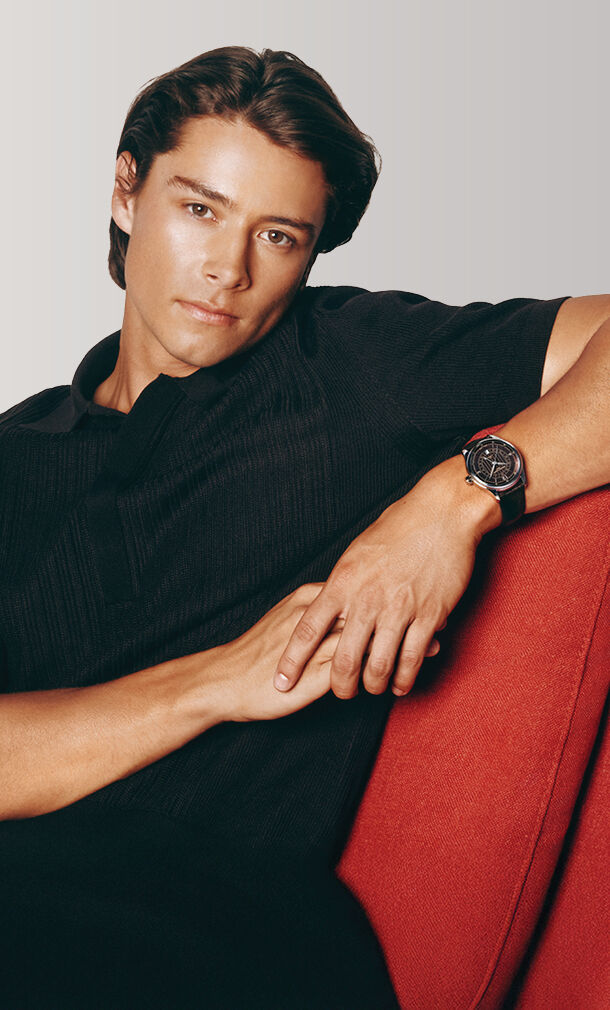 Image of a man sitting on a sofa wearing Classics Runabout Automatic watch model FC-350RBR5B6